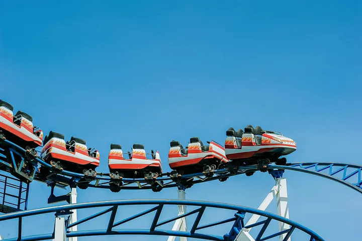 A rollercoaster against a blue sky